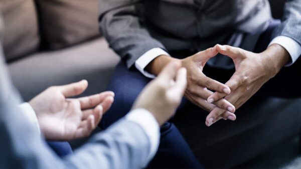 The hands of a marketing professional talking to a customer